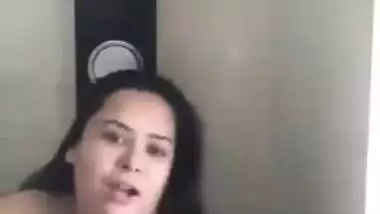 Gorgeous Desi aunty with huge XXX breasts fools around in bathroom